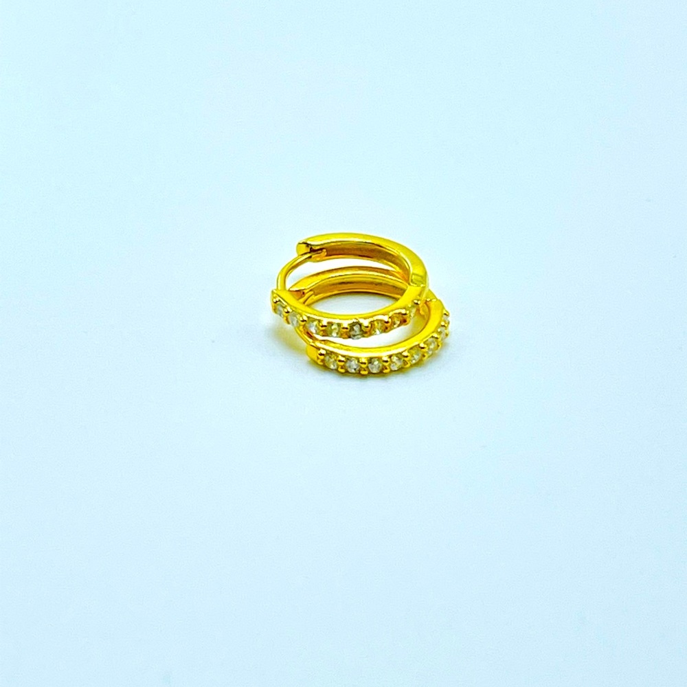 Tiny huggie hoop cz earings. 18k gold over 925 sterling silver. Stamp on back.